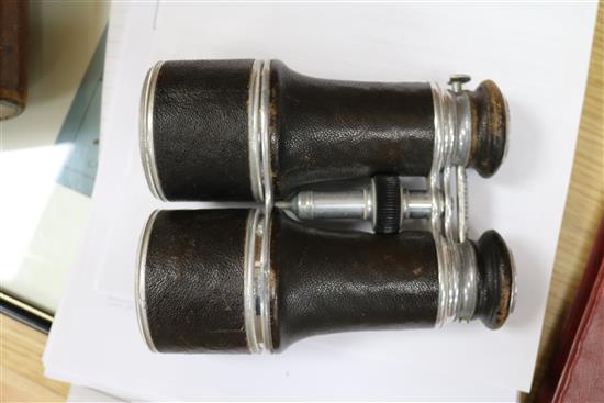 A pair of leather cased binoculars